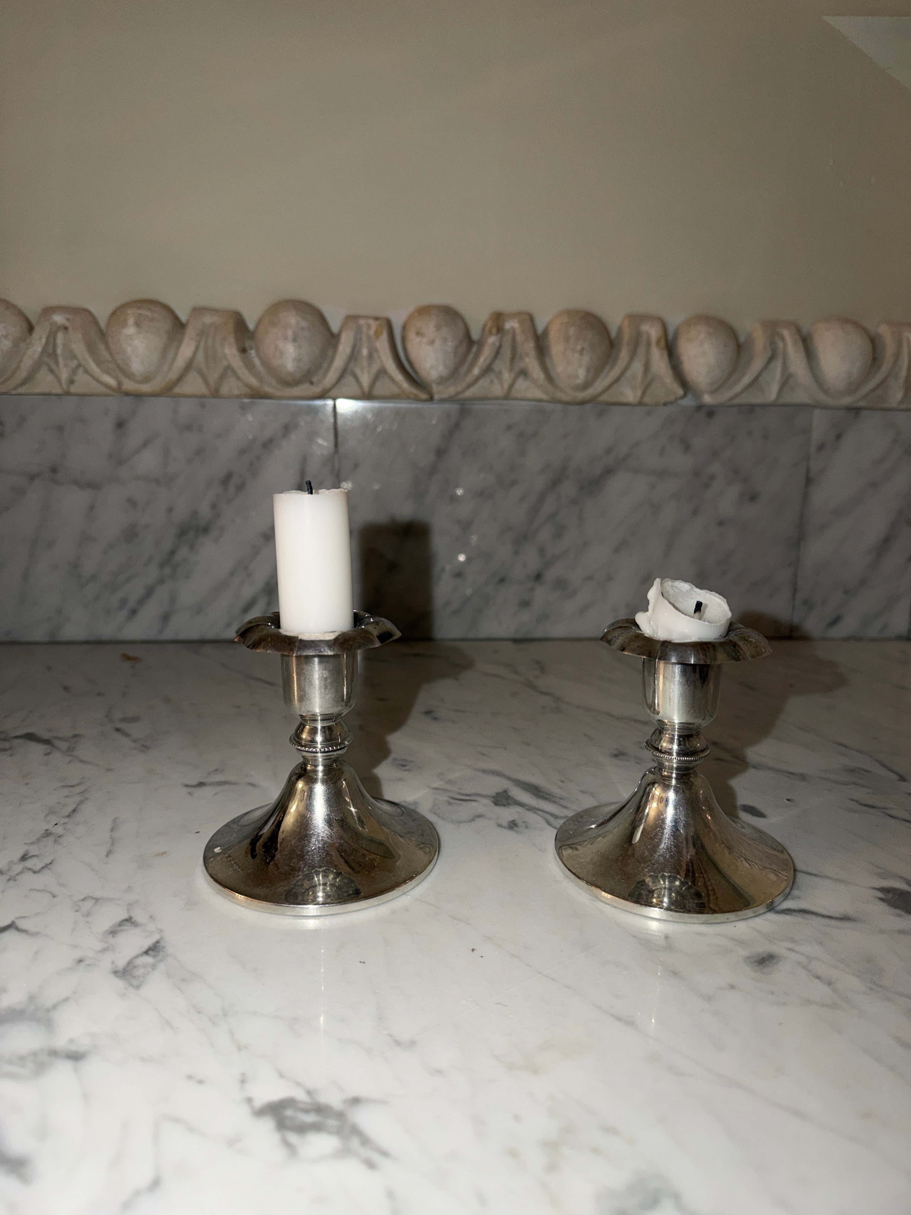 A pair of silver candlesticks