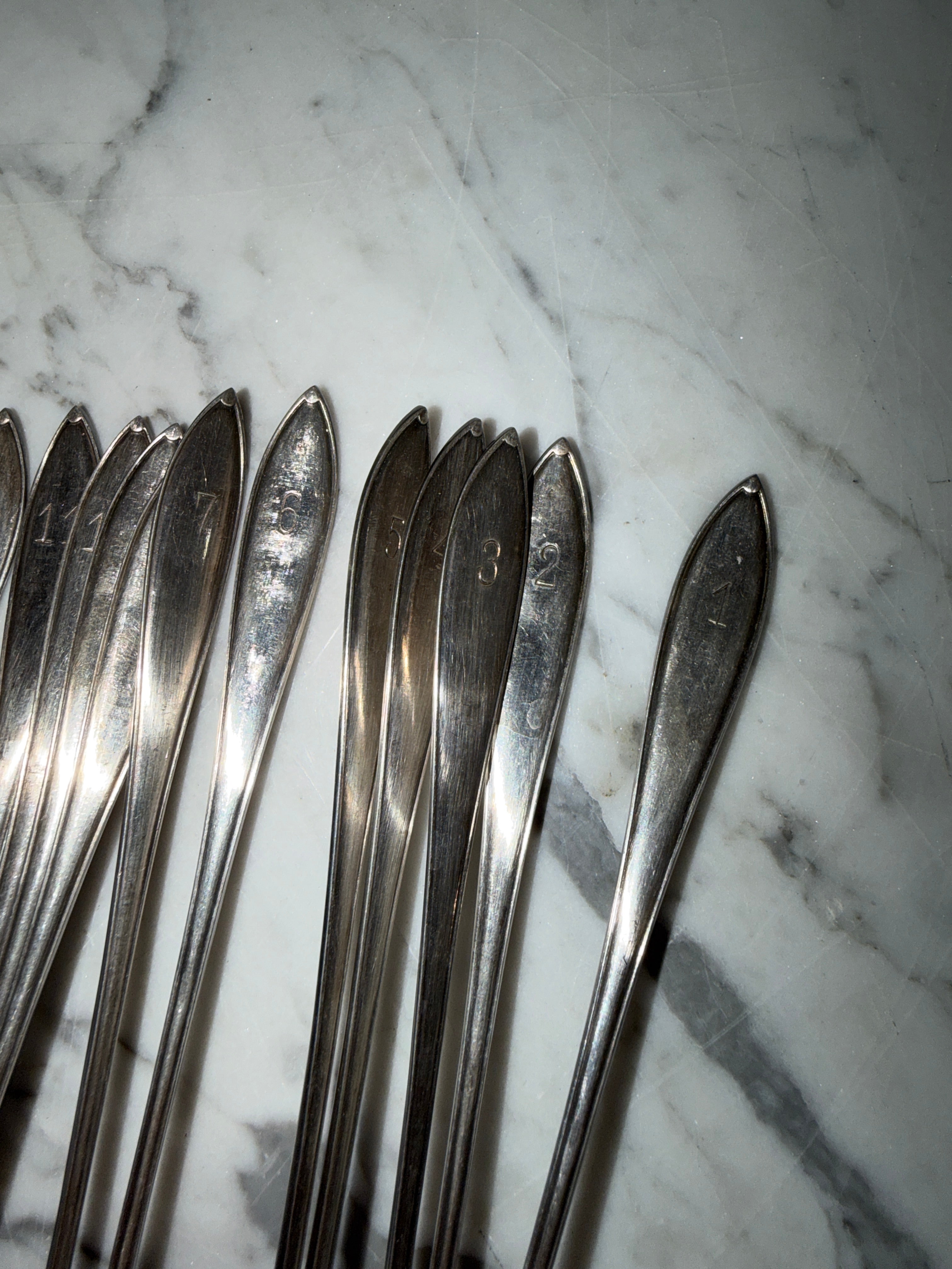 A set of 12 dessert/cocktail spoons