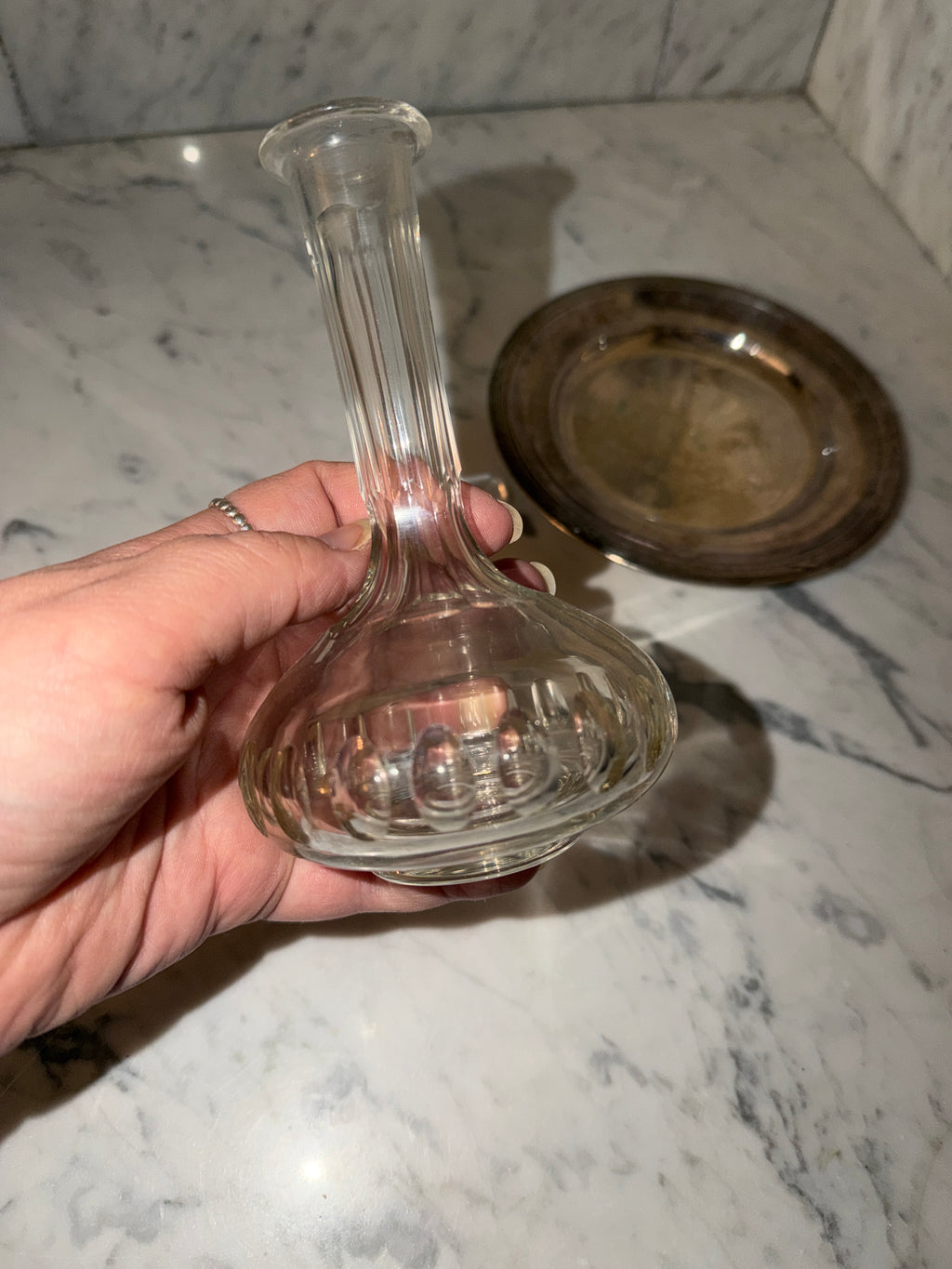 Small crystal bottle with a new silver tray