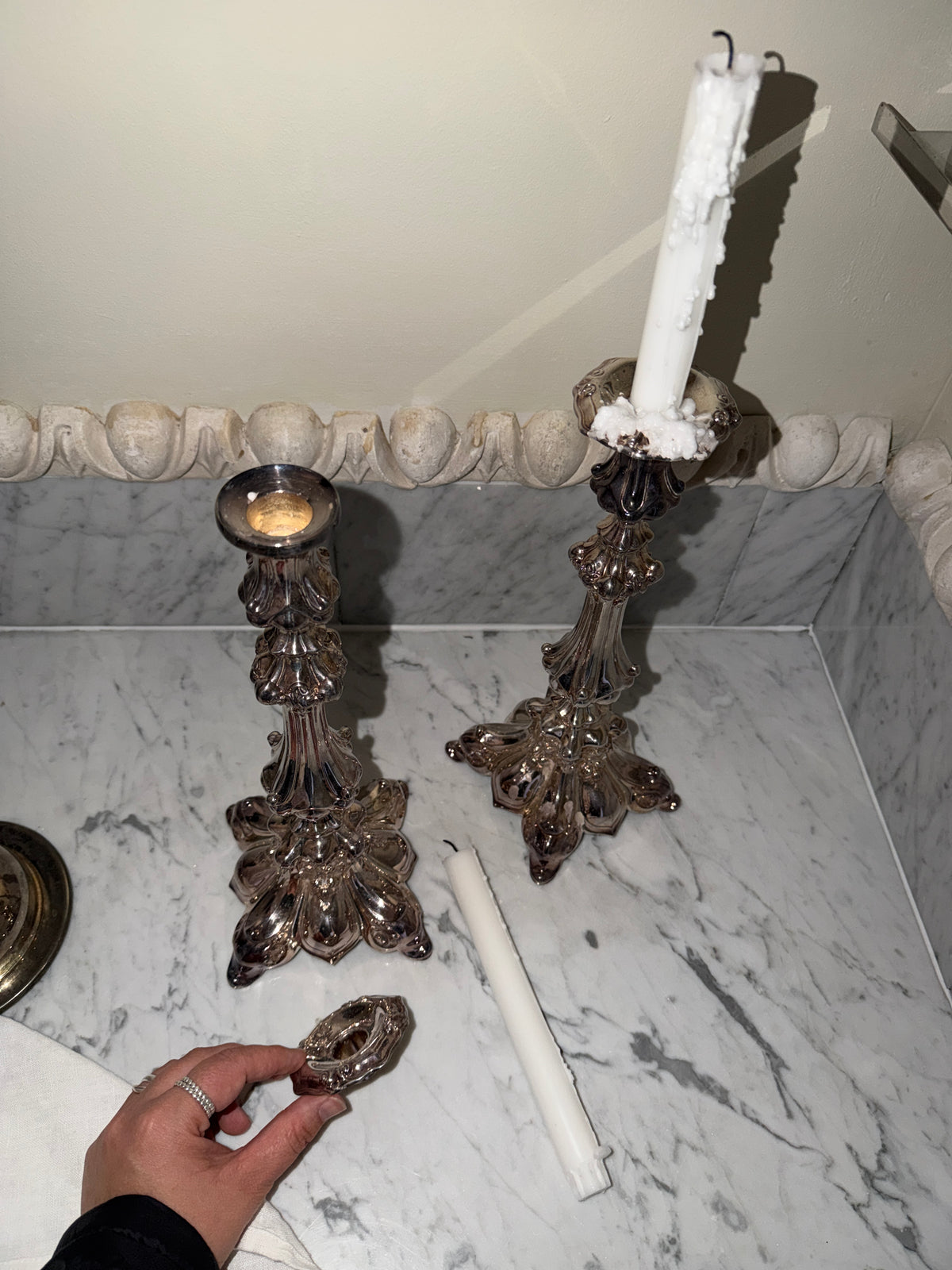 A pair of antique candlesticks
