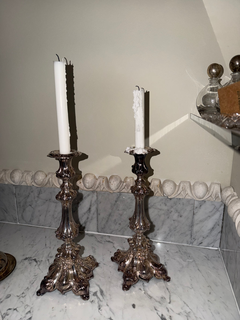 A pair of antique candlesticks