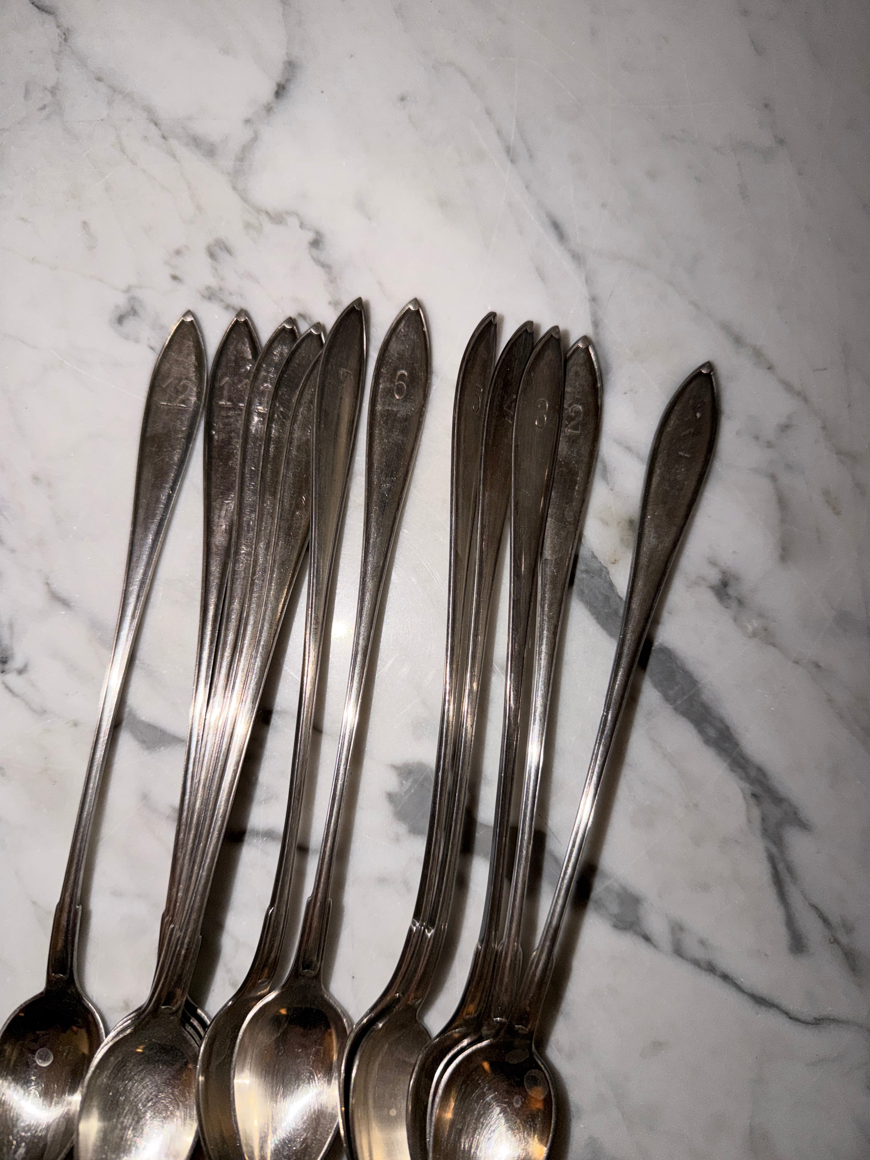 A set of 12 dessert/cocktail spoons