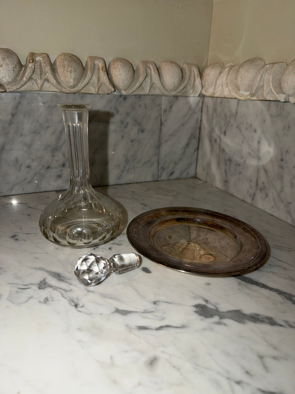 Small crystal bottle with a new silver tray