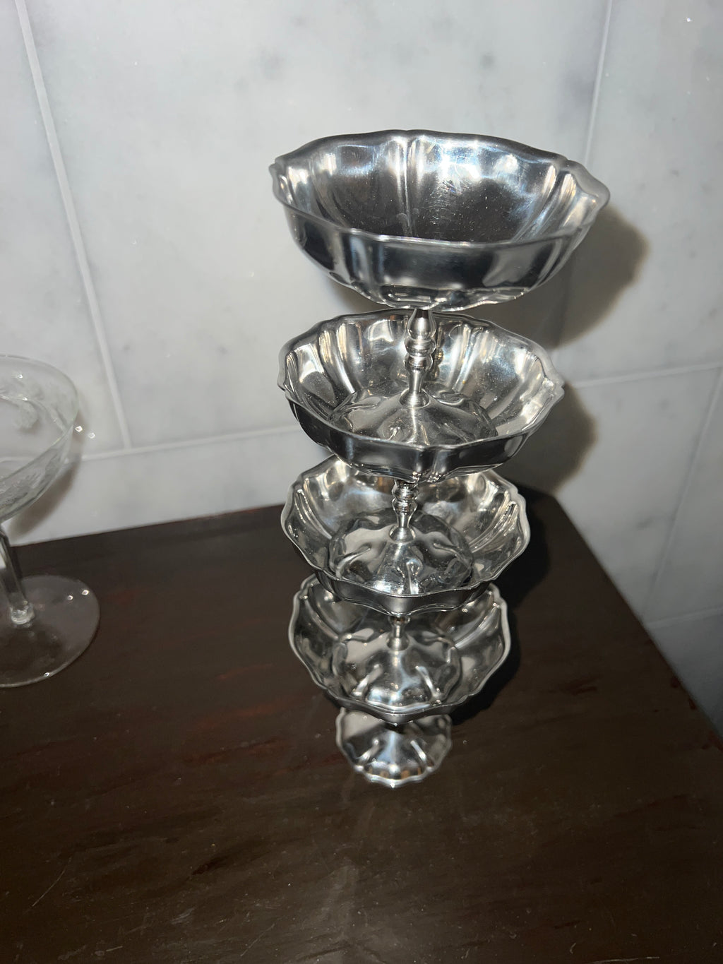 A set of four vintage stainless steel dishes