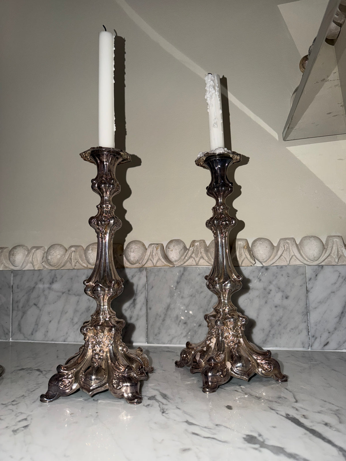 A pair of antique candlesticks