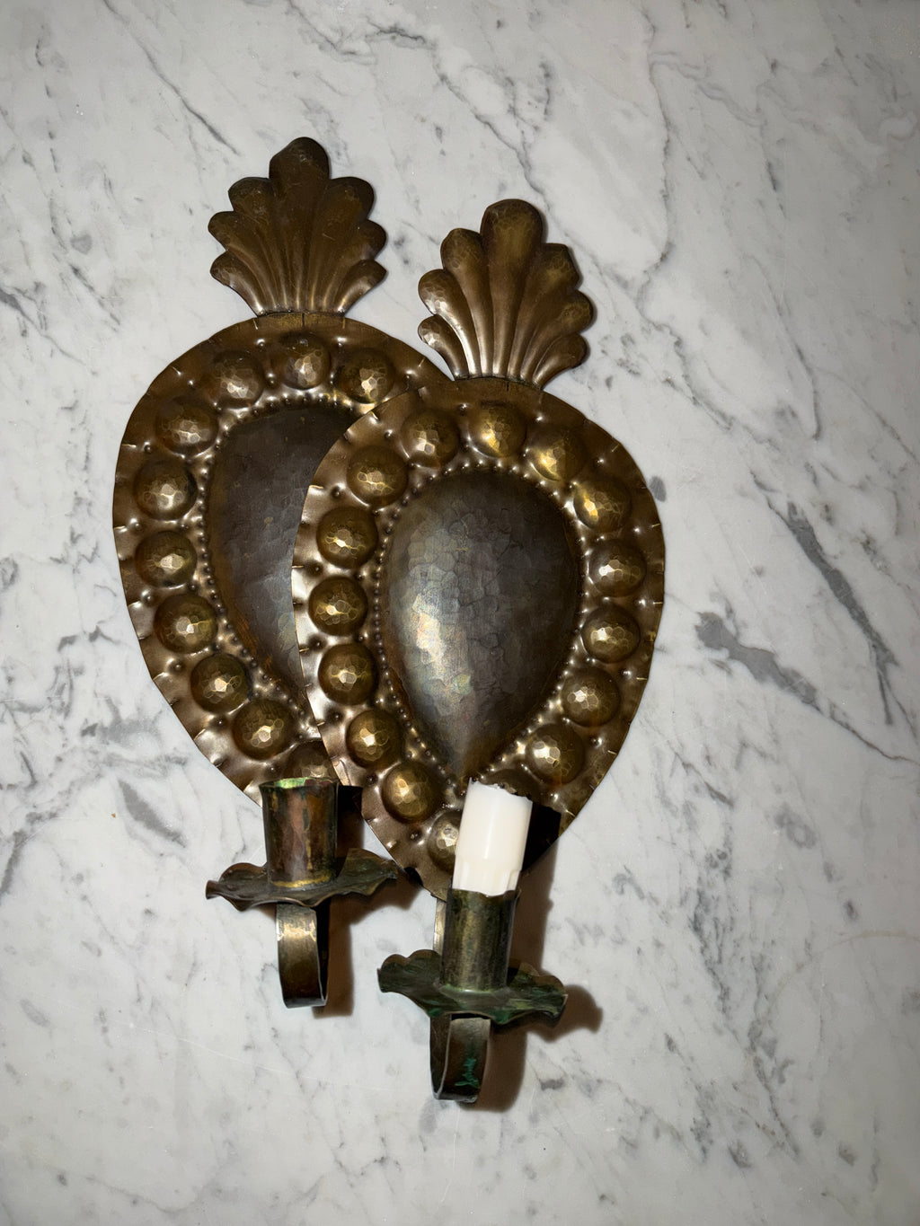 A pair of antique candle sconces