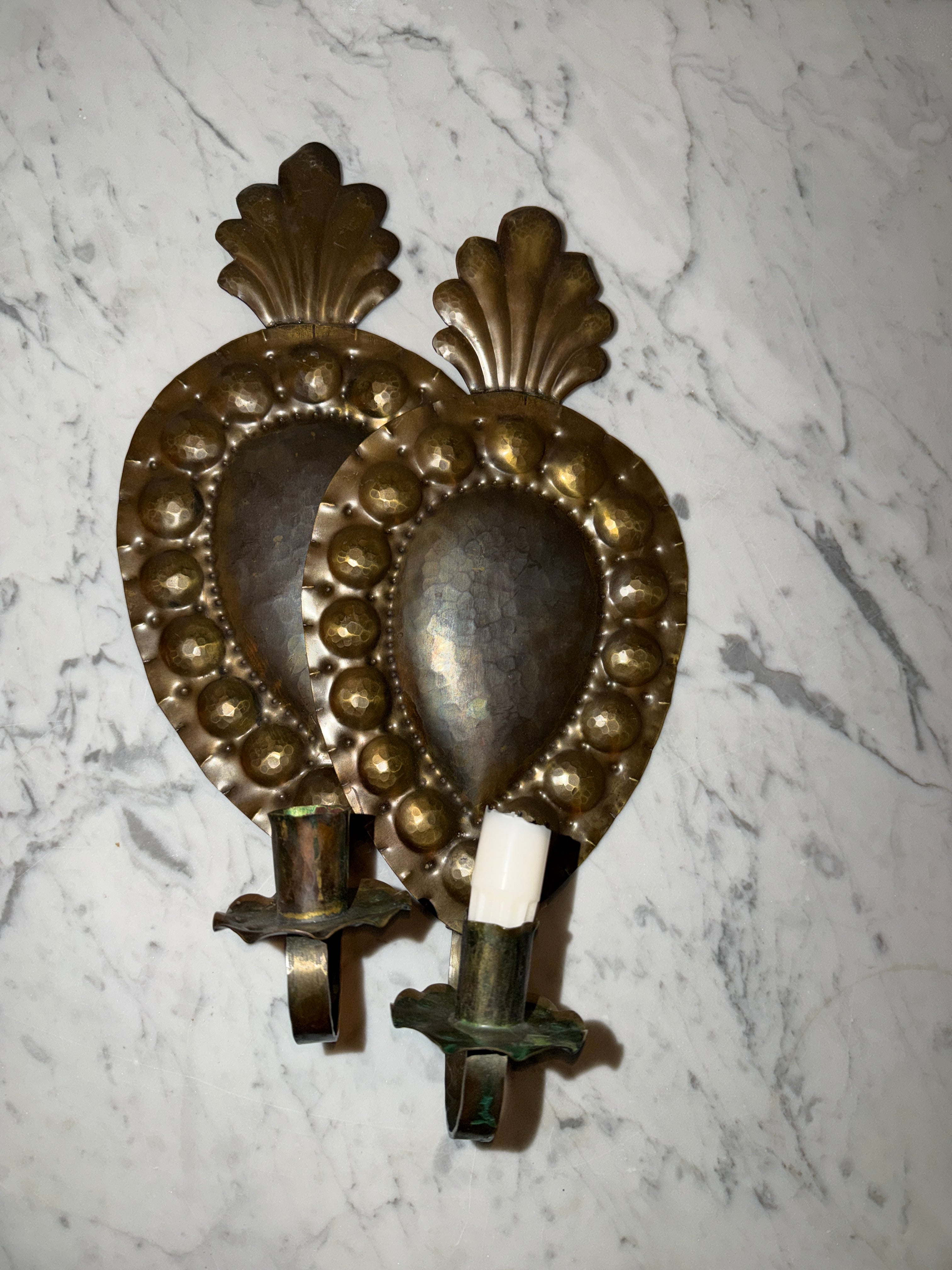 A pair of antique candle sconces
