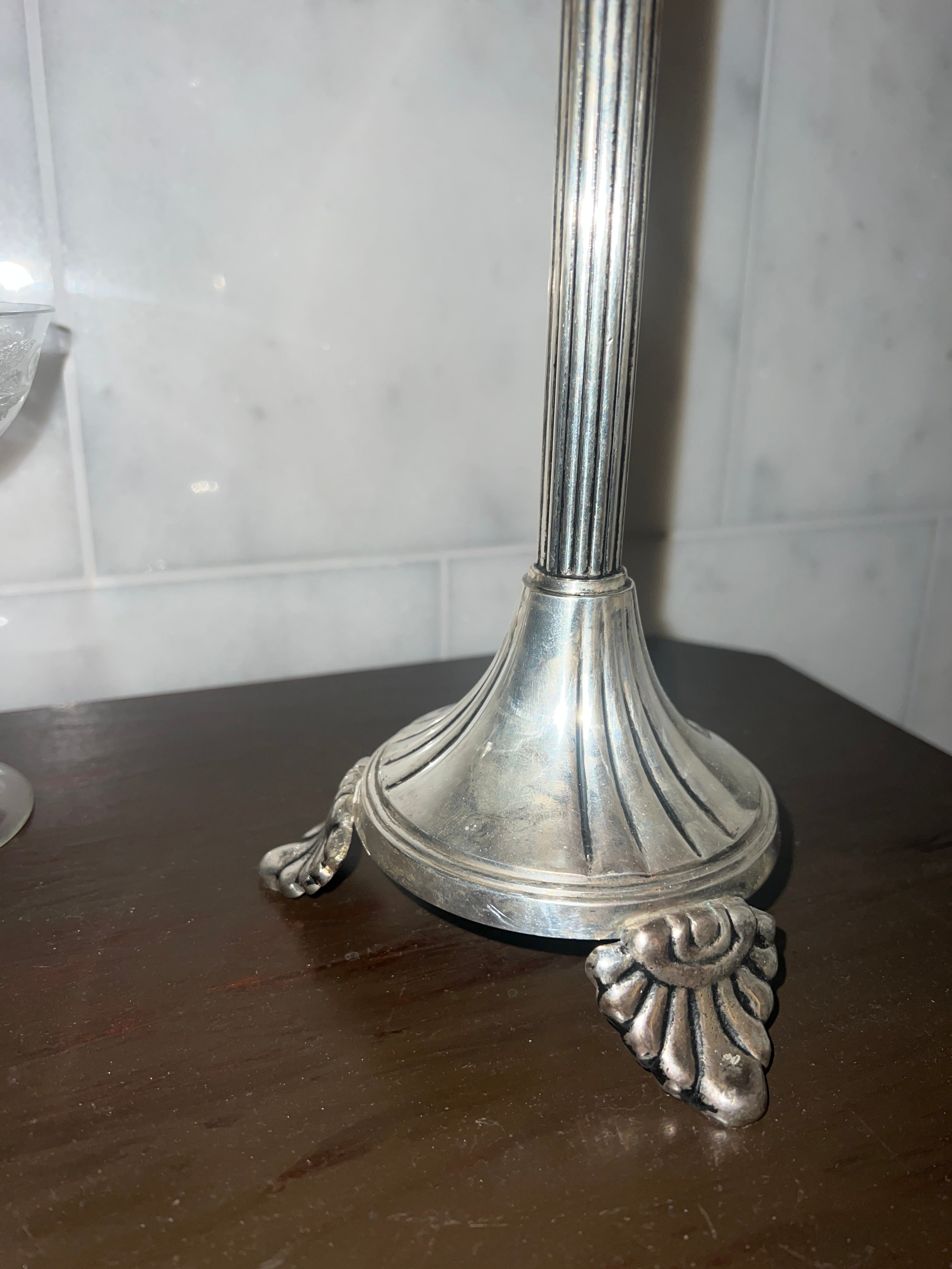 A tall vintage candle stick