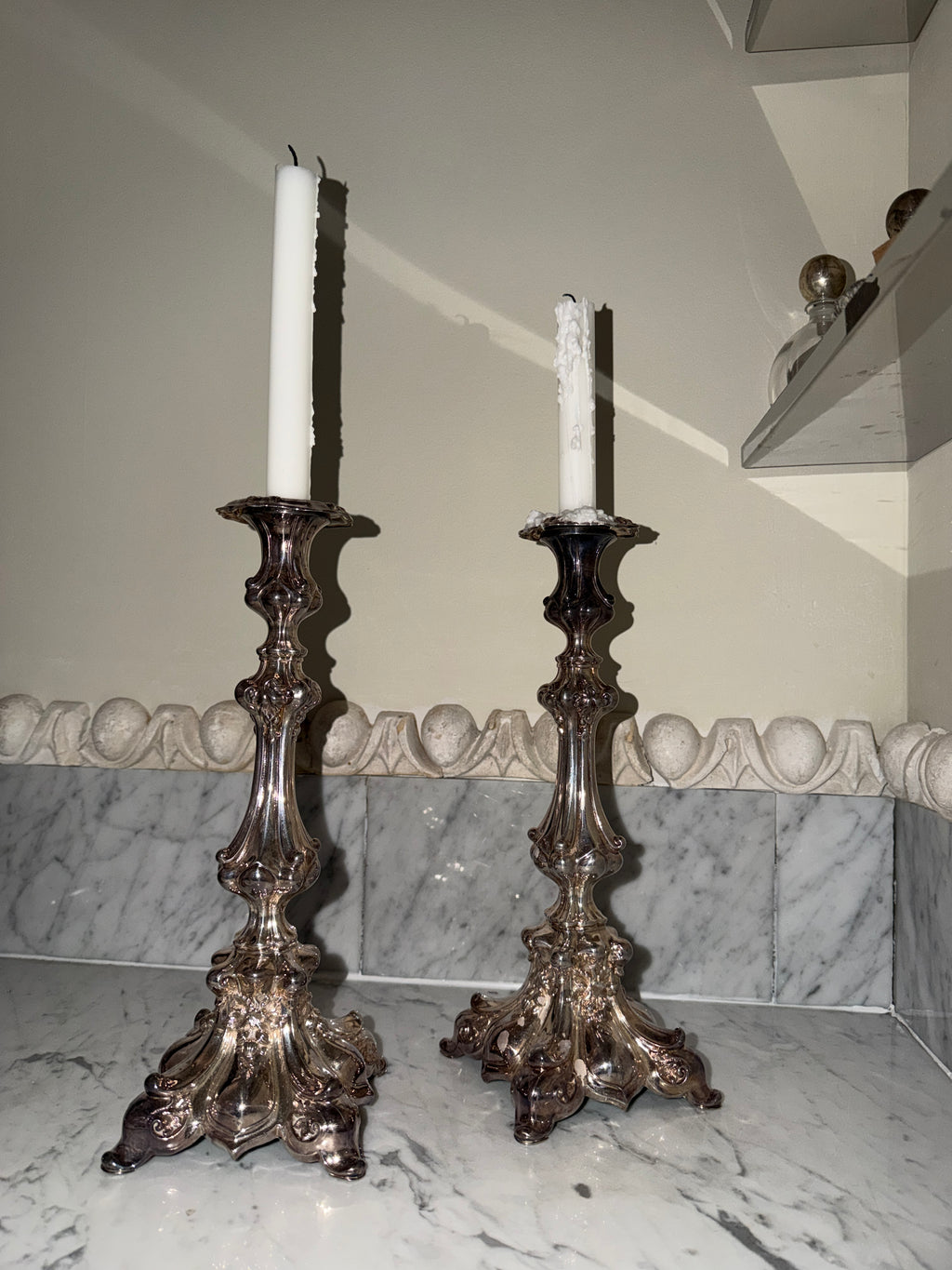 A pair of antique candlesticks