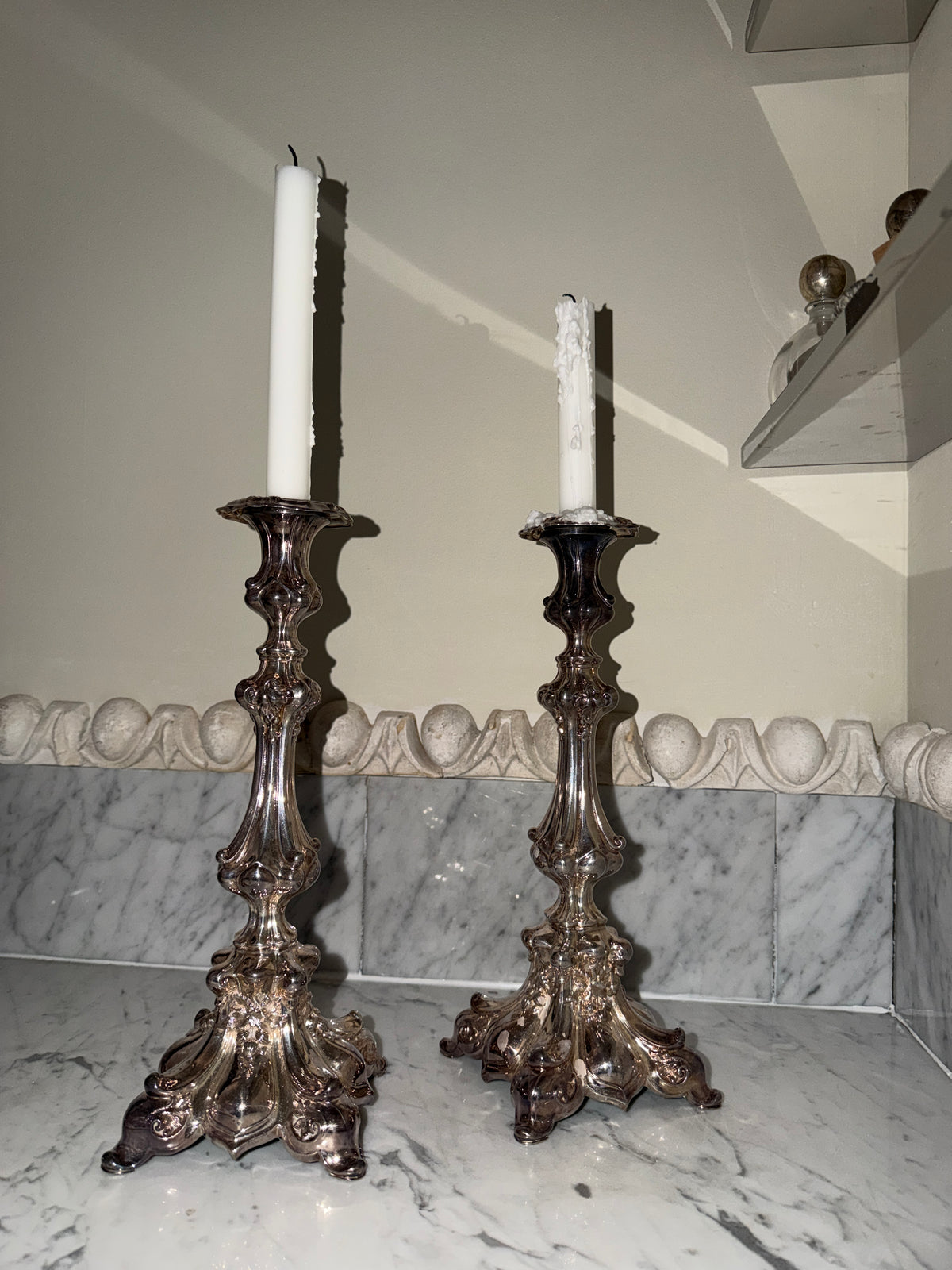 A pair of antique candlesticks