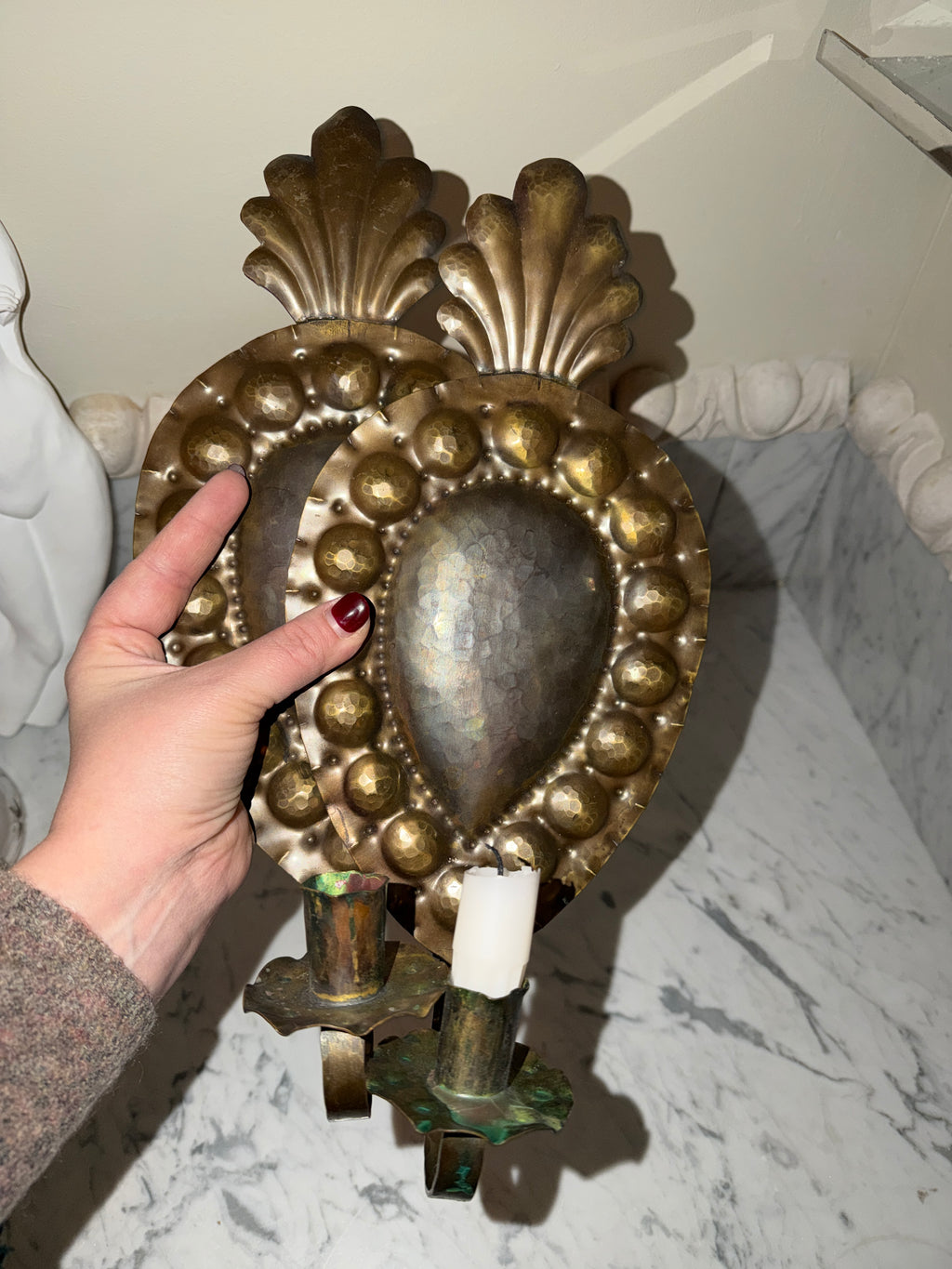 A pair of antique candle sconces