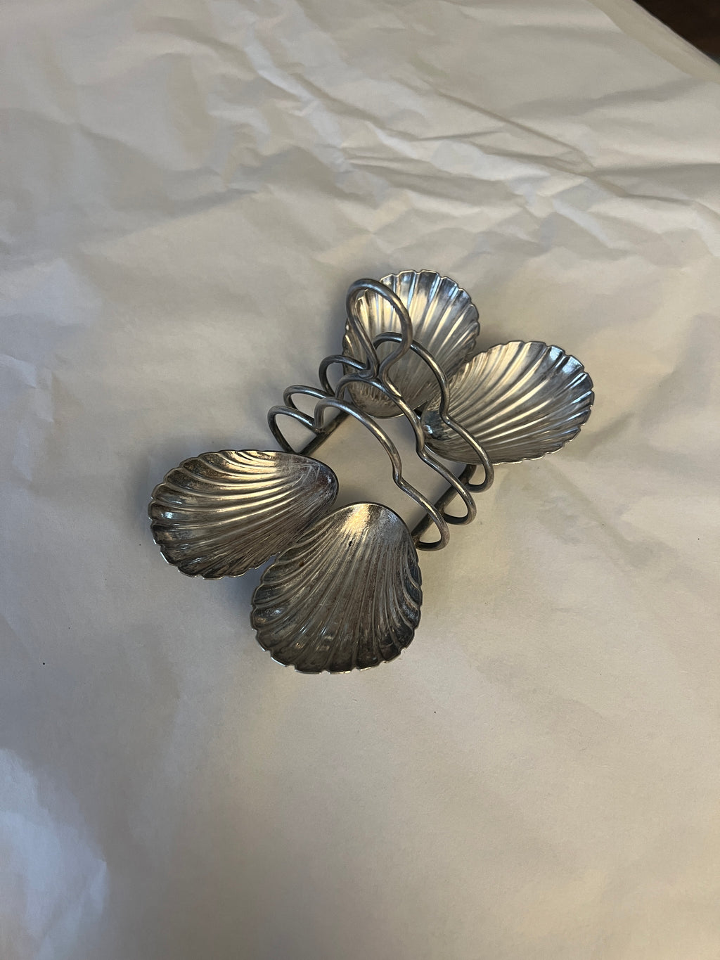 Antique silver-plated toast rack with sea shell details