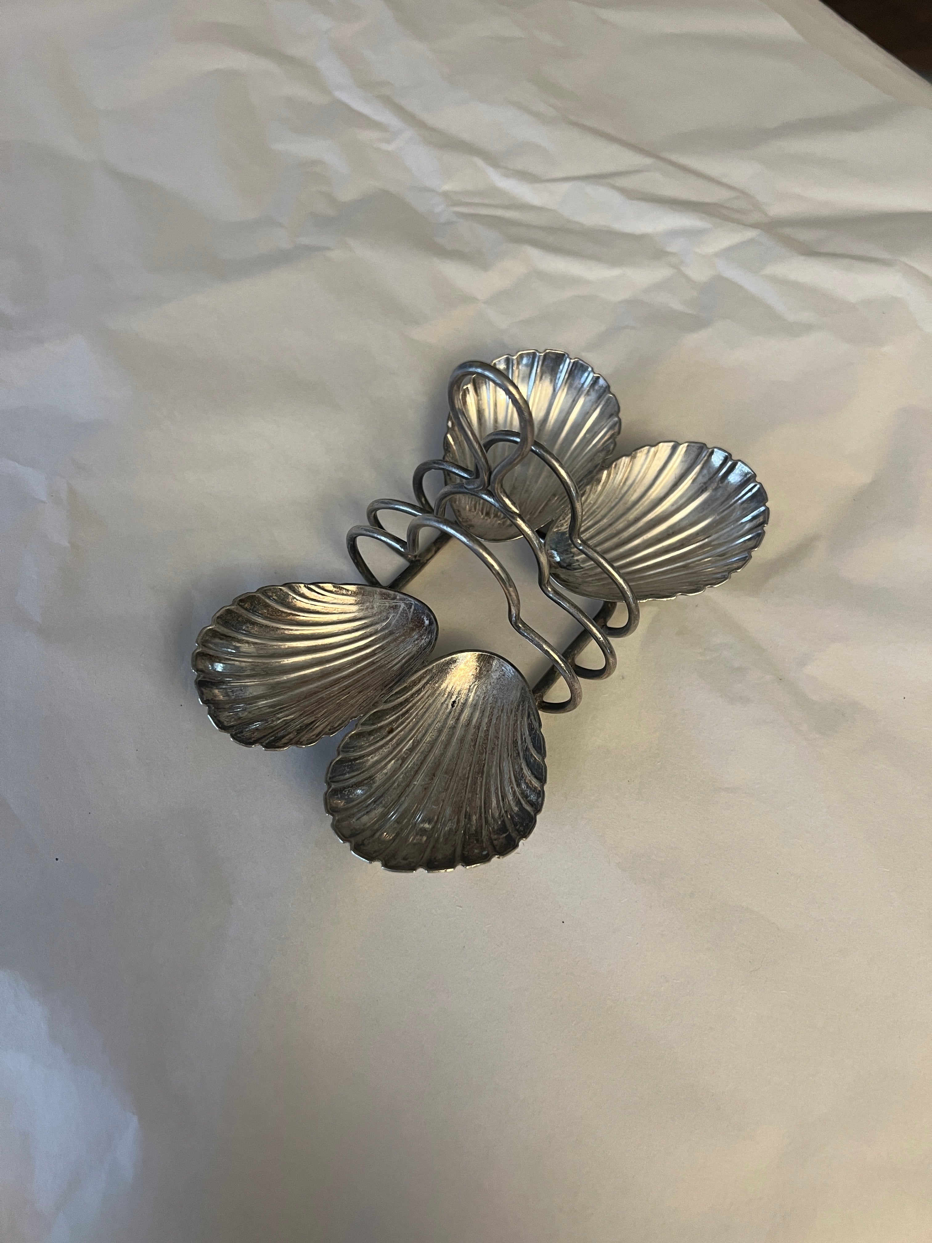 Antique silver-plated toast rack with sea shell details