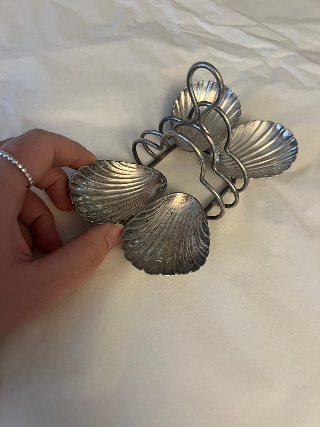 Antique silver-plated toast rack with sea shell details