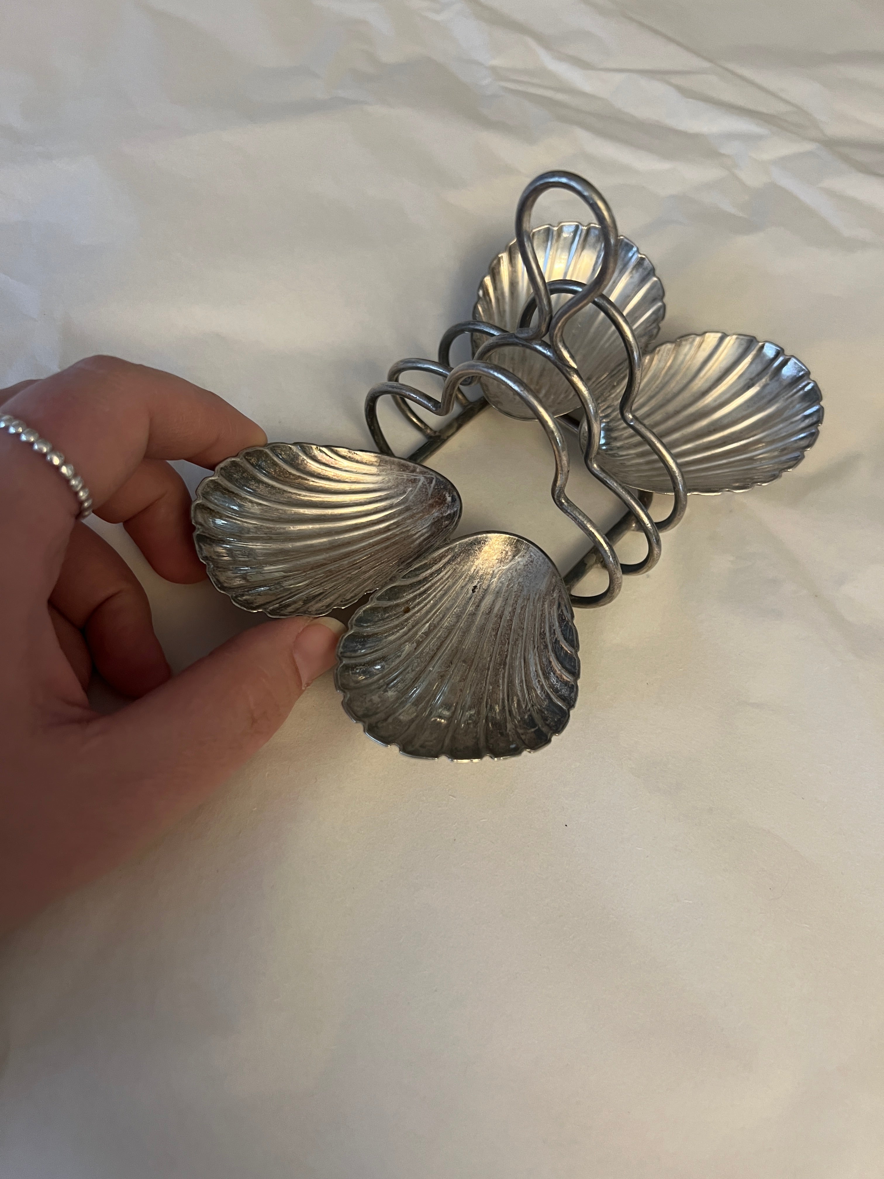 Antique silver-plated toast rack with sea shell details
