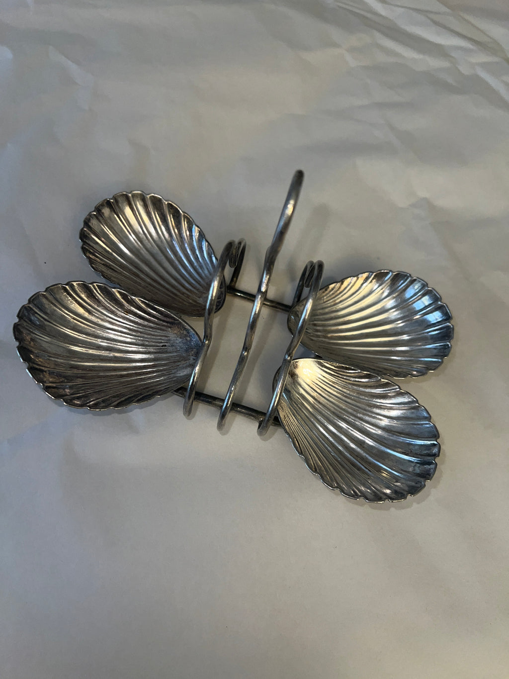 Antique silver-plated toast rack with sea shell details