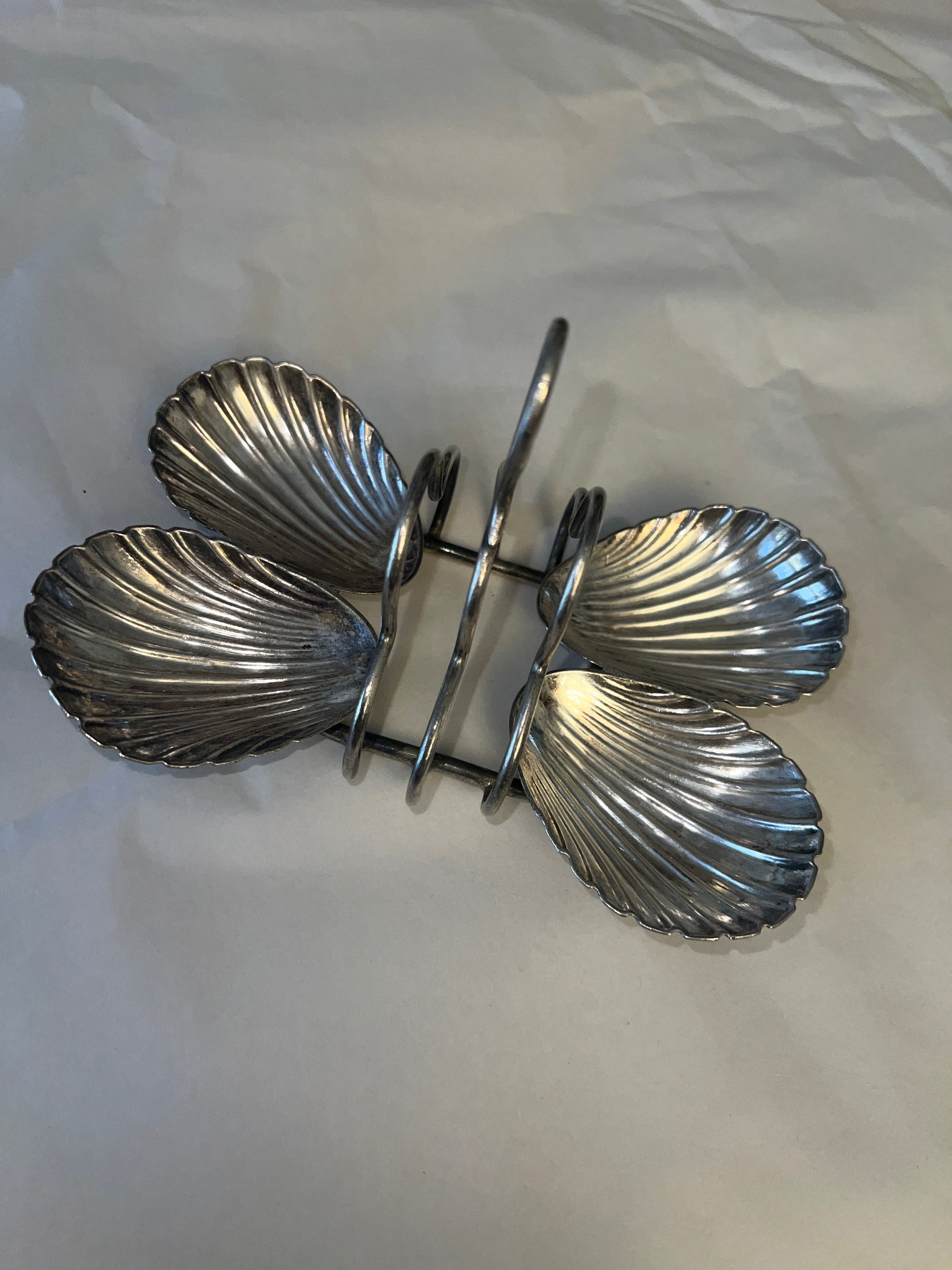 Antique silver-plated toast rack with sea shell details