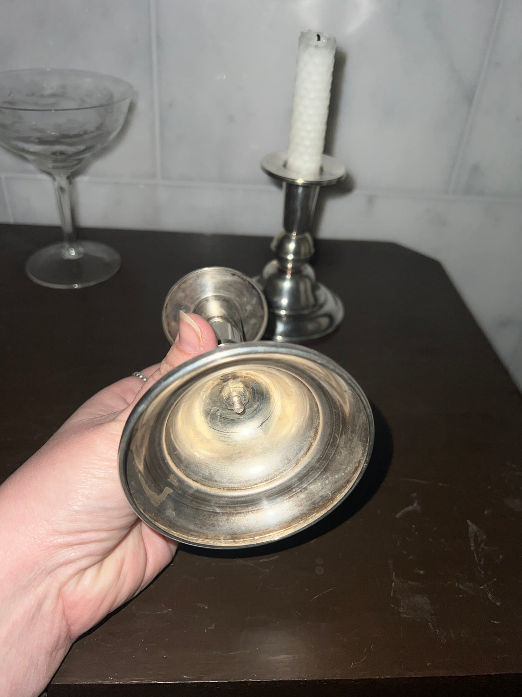 A pair of candle sticks in new silver