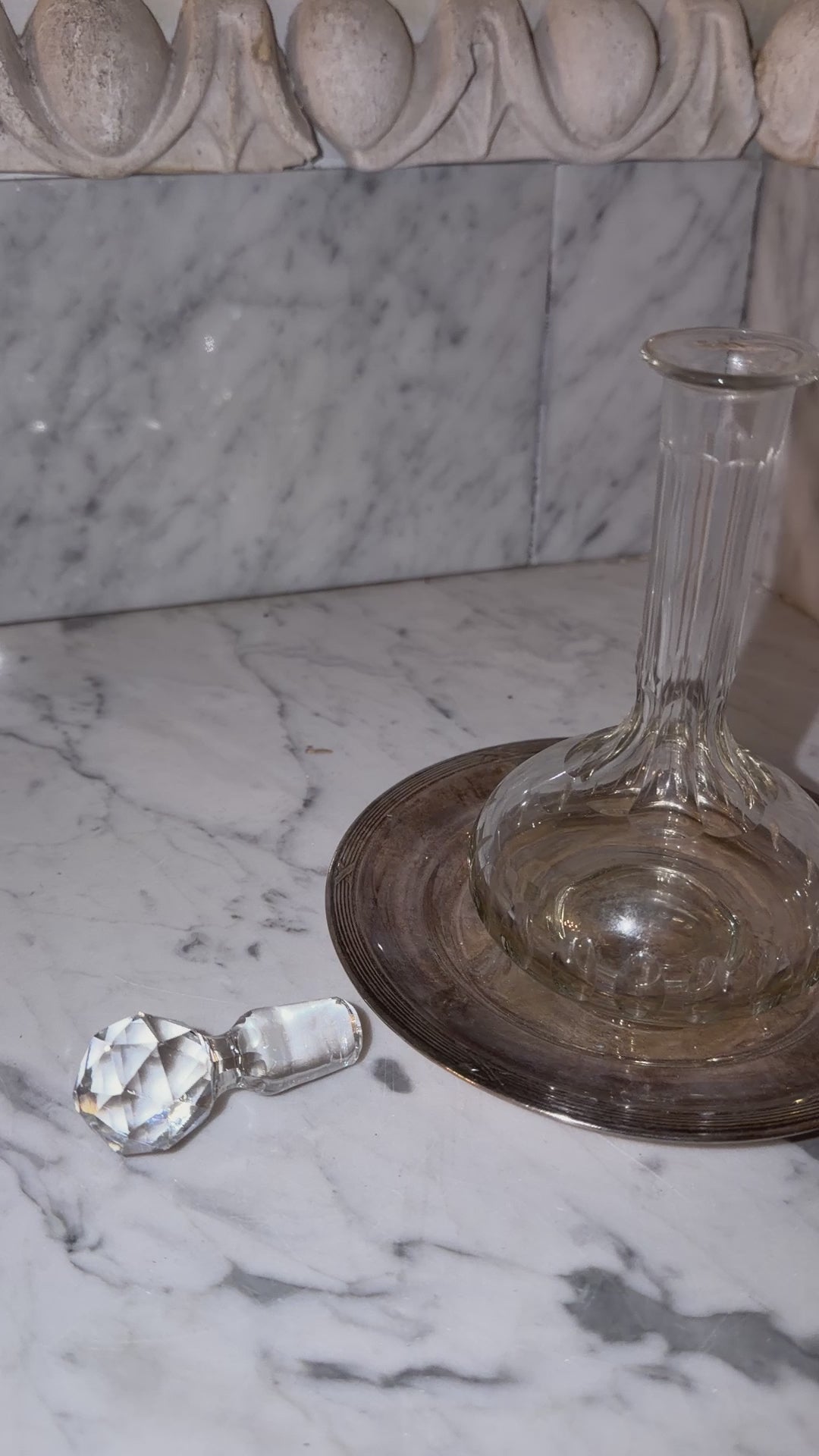 Small crystal bottle with a new silver tray