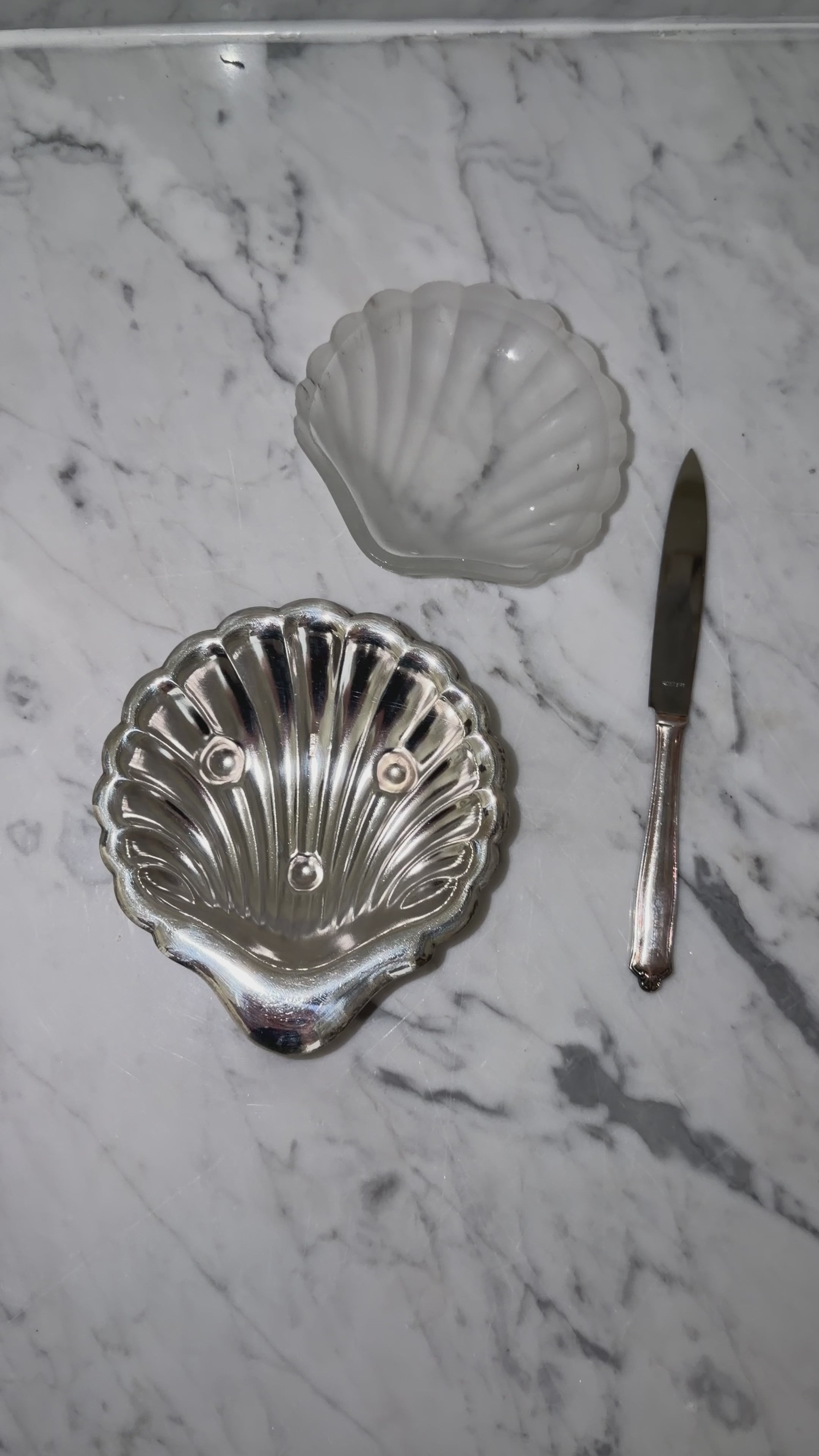 Shell butter dish with a serving knife